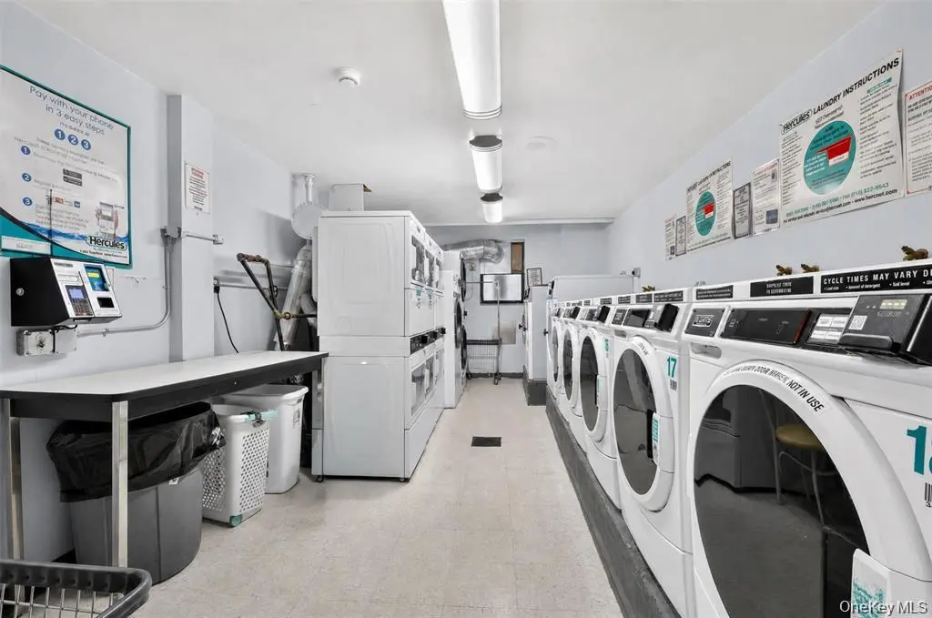 Building laundry room with washers and dryers