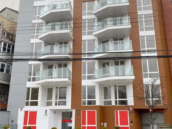 Modern condominium building exterior on Parsons Boulevard