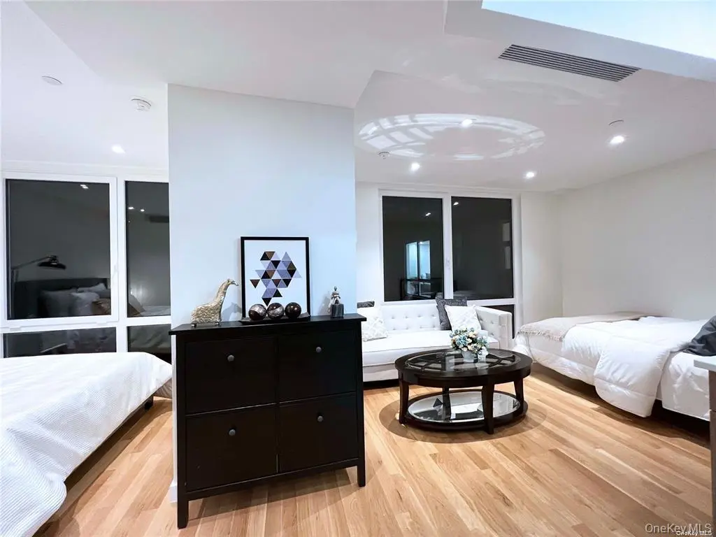 Large staged flexible room with floor-to-ceiling windows