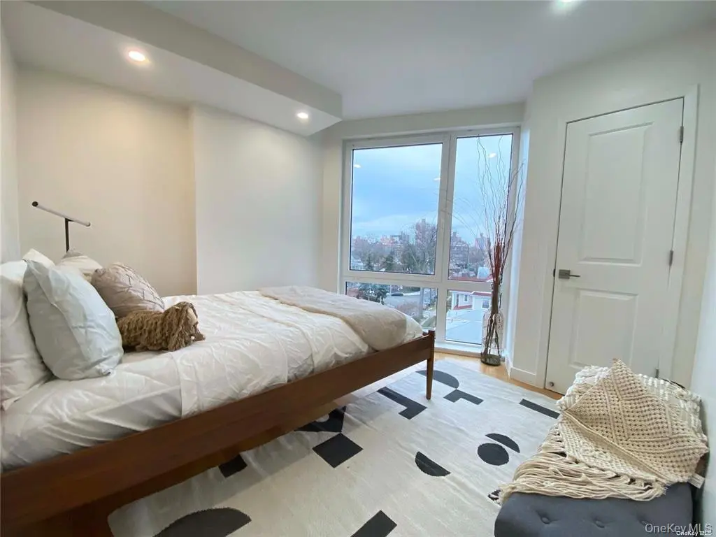 Bedroom with neighborhood view