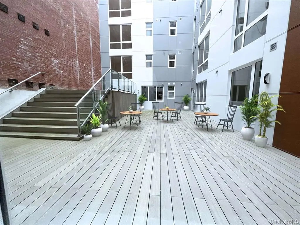 Resident garden courtyard with tables and seating