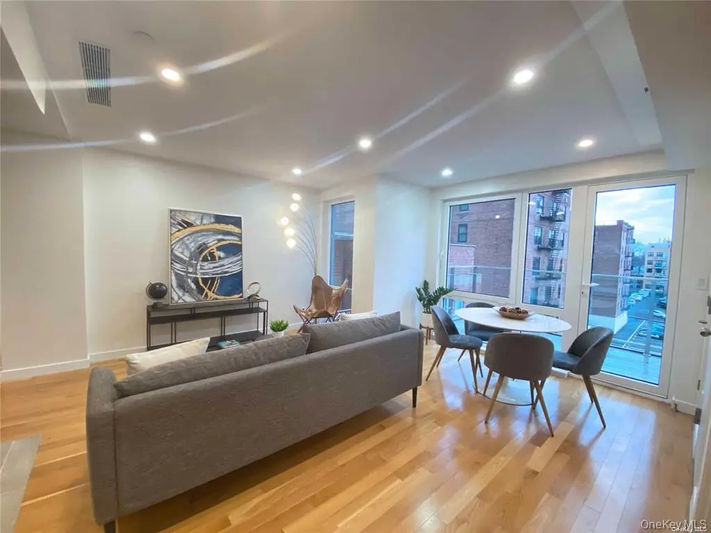 Bright living and dining area with balcony doors