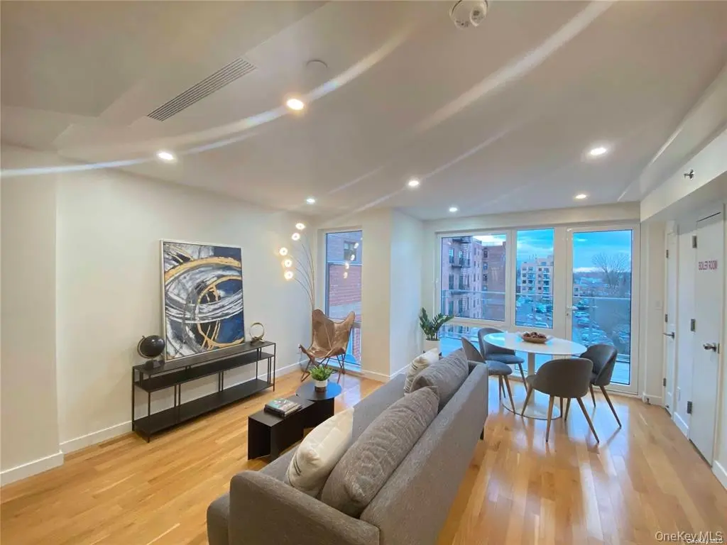 Open living and dining room with floor-to-ceiling windows