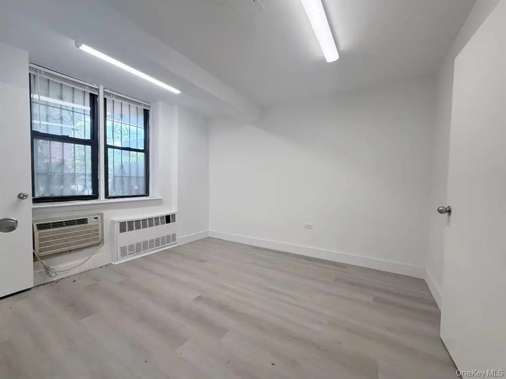 Office space with window and air conditioner
