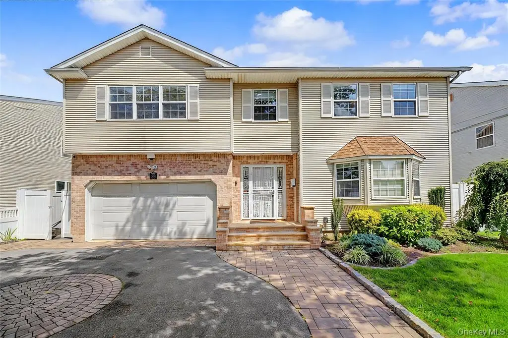 Front exterior with garage and driveway