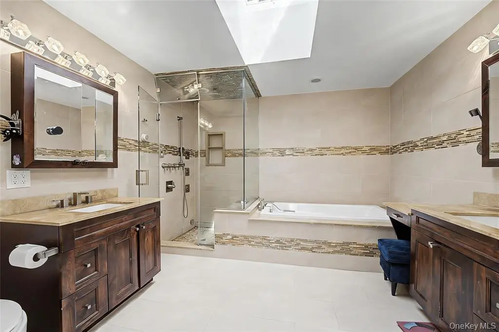 Bathroom with double vanity and tub