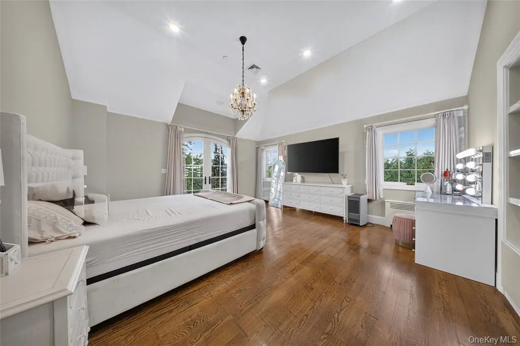Bedroom with bed and chandelier