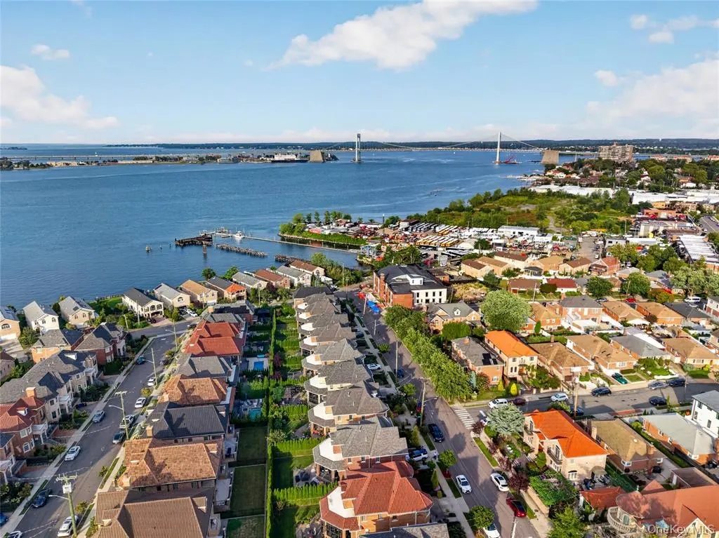 Aerial neighborhood view toward the waterfront and bridge