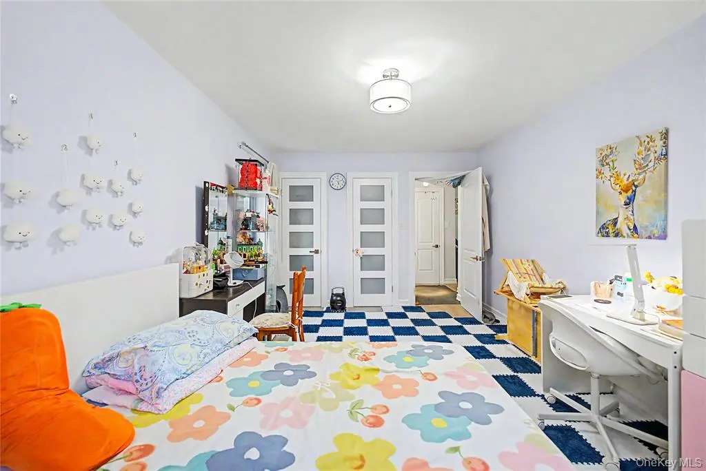 Bedroom with storage and two windows
