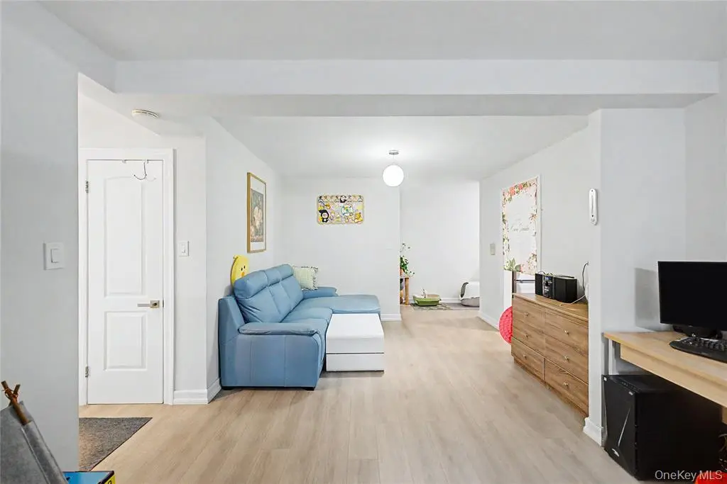 Living room with seating and television