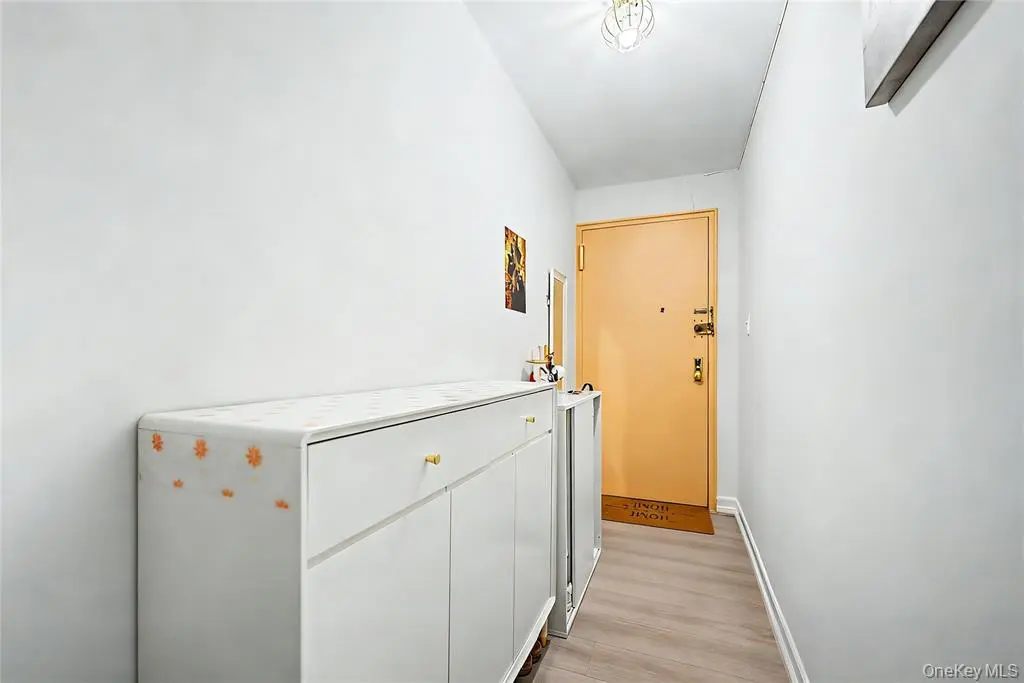 Entry hallway with built-in storage cabinets