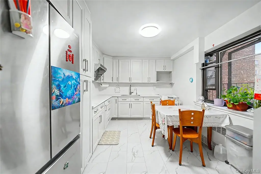 Walk-through kitchen with dining table