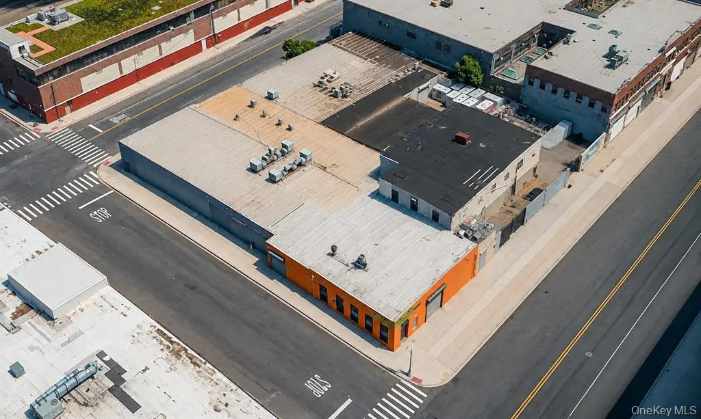 Angled aerial view of the warehouse roof and lot