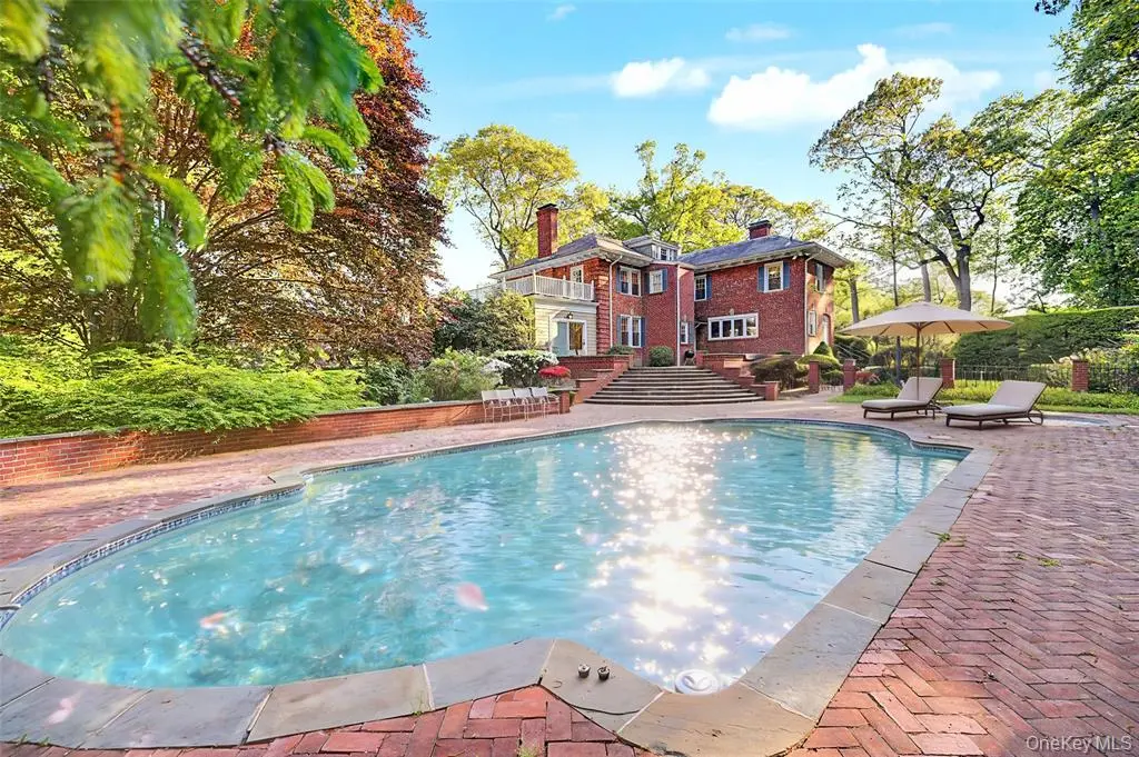 Heated in-ground pool and brick patio