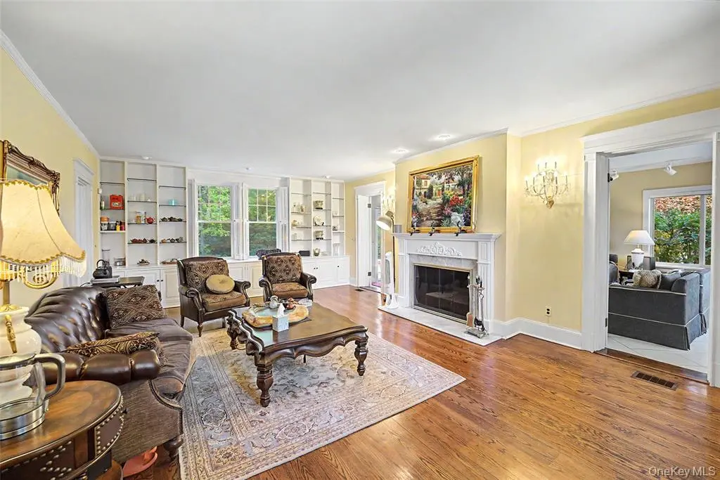 Formal living room with fireplace and large windows