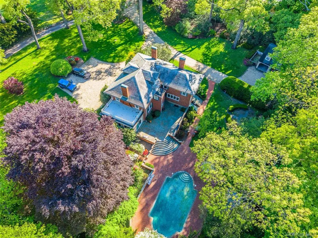 Aerial view of the main house, pool, and guest house