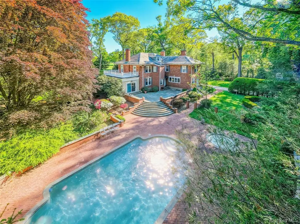Aerial rear view of the property and swimming pool