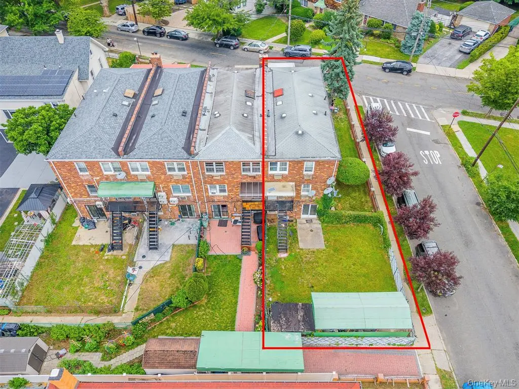 Aerial view of the corner property and lot