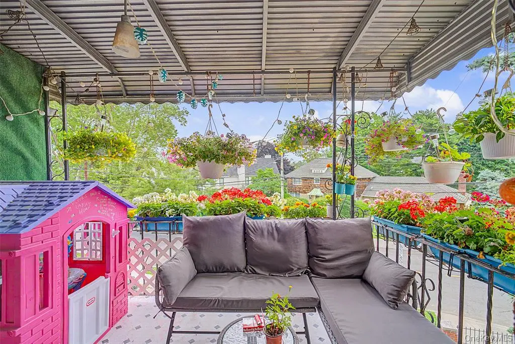 Covered balcony overlooking the yard