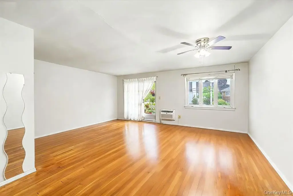 Bright bedroom with hardwood floor