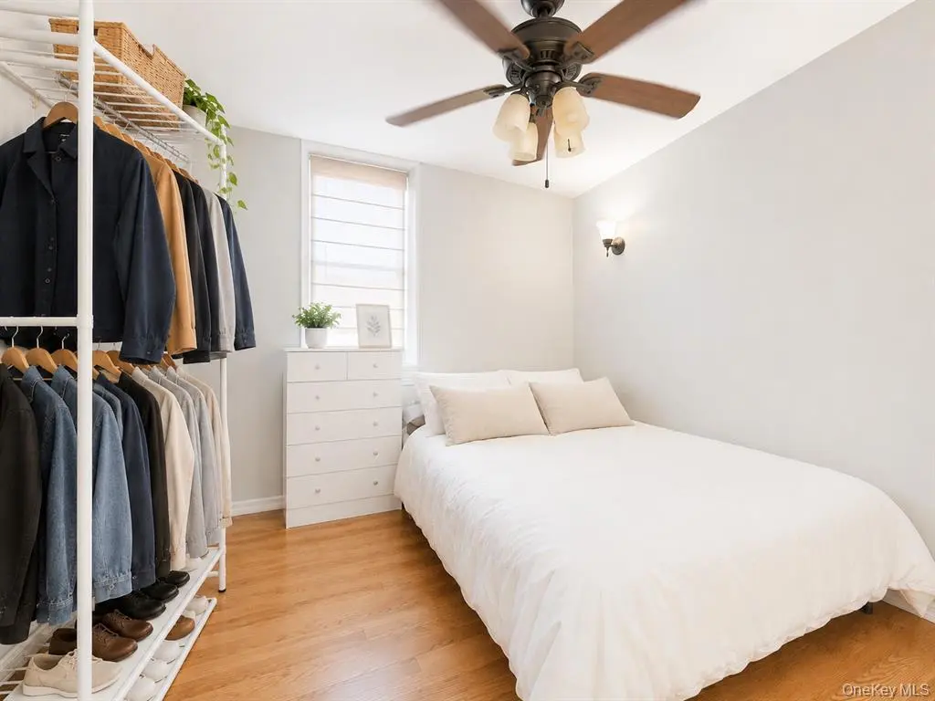 Bright bedroom with ceiling fan