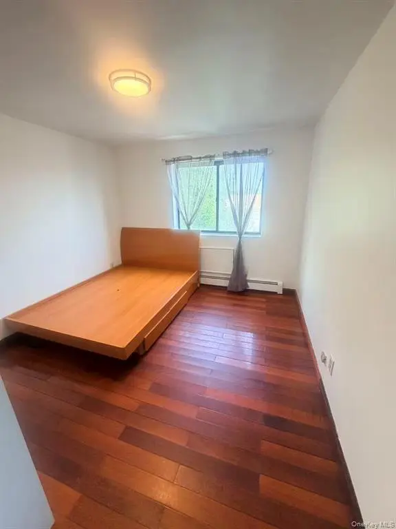 Furnished bedroom with window