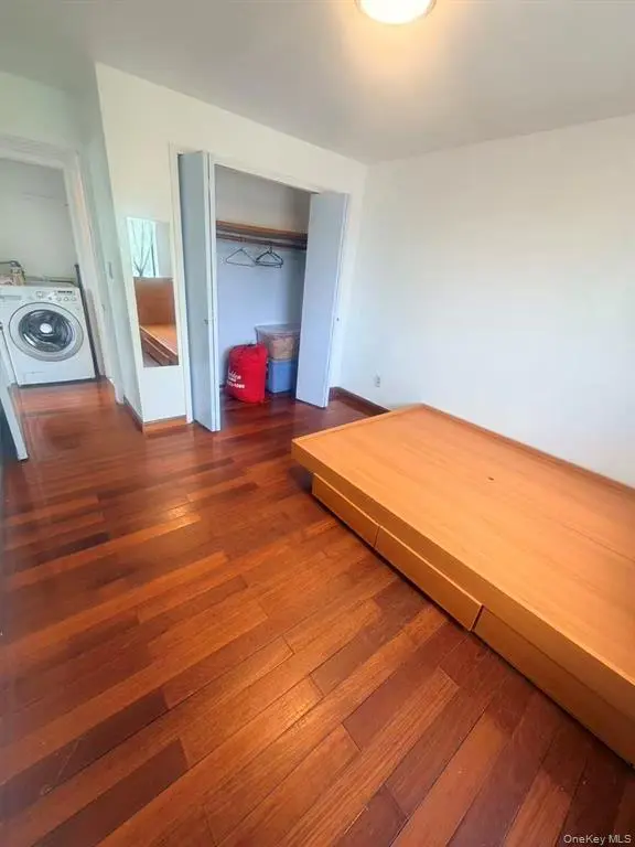 Bedroom with in-unit washer and dryer