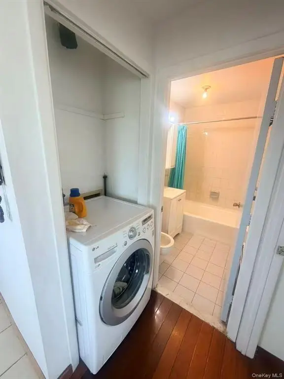Washer beside the bathroom