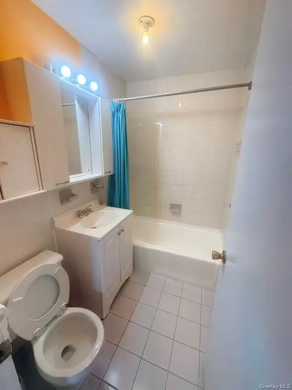 Full bathroom with tub and vanity