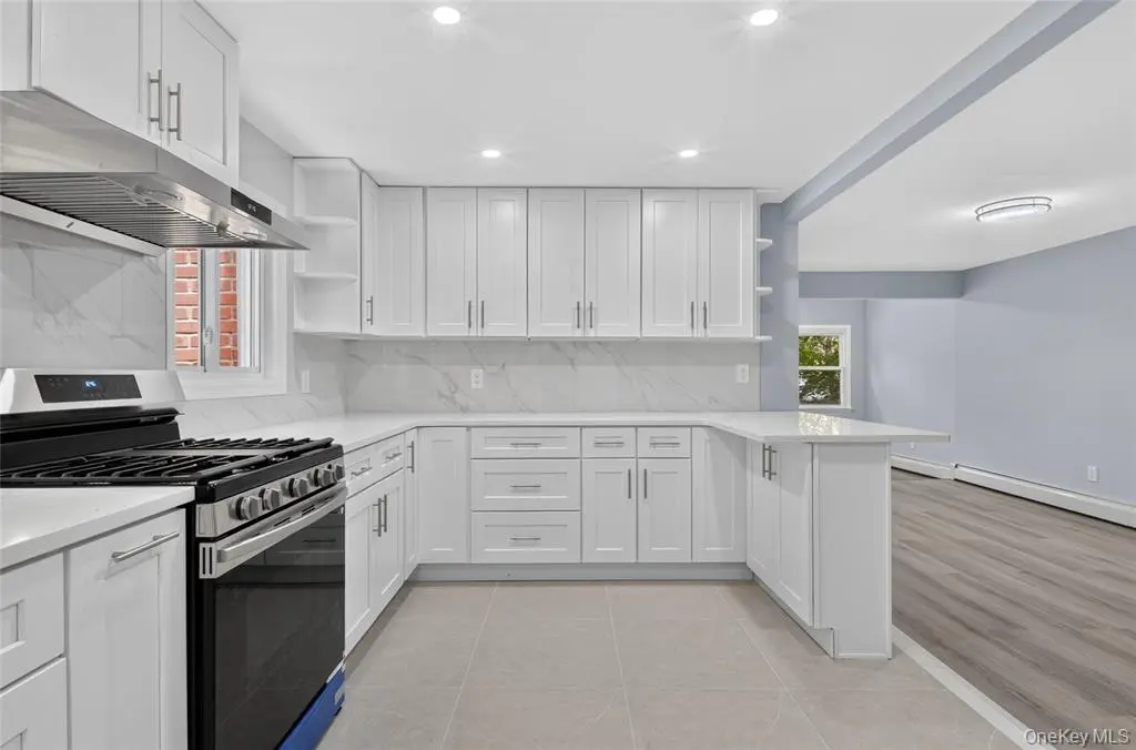 White kitchen with stone counters