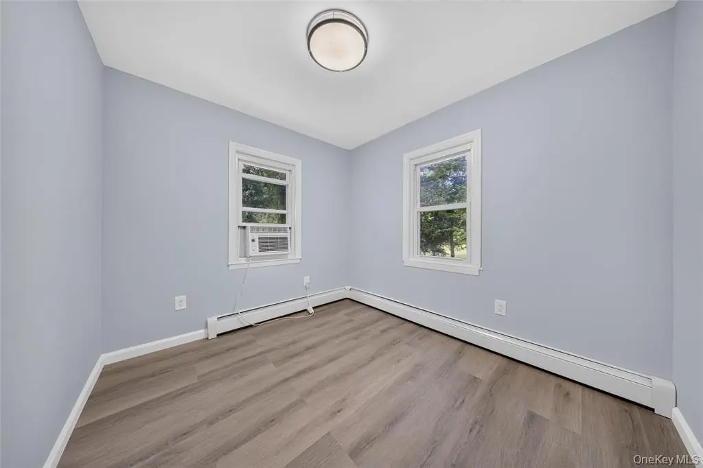Bedroom with corner windows