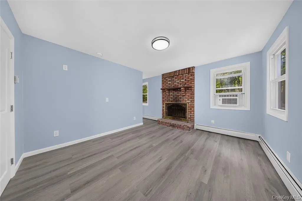Living room with brick fireplace