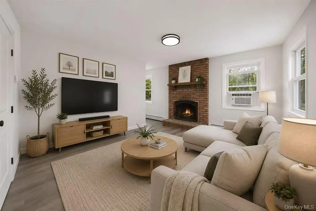 Staged living room with fireplace