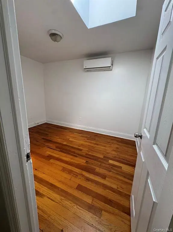Additional bedroom with hardwood floor