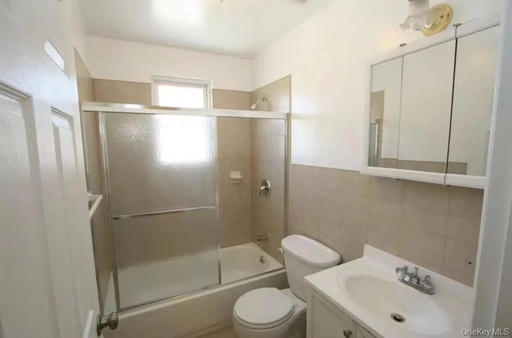 Updated full bathroom with glass shower