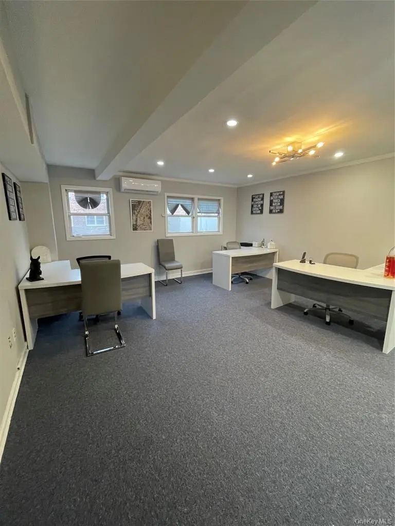 Finished private office workspace with desks and windows
