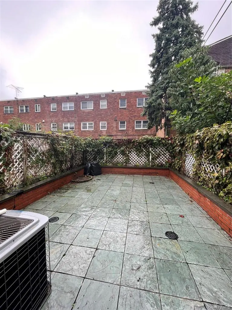 Paved outdoor courtyard behind the office building