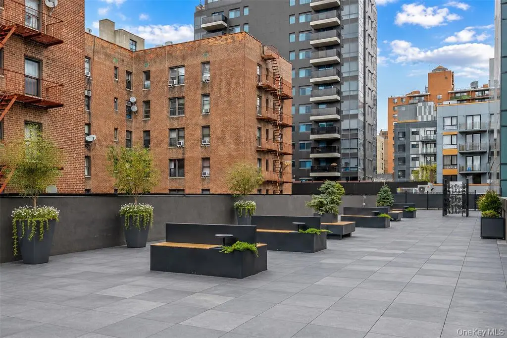 Landscaped outdoor terrace with seating