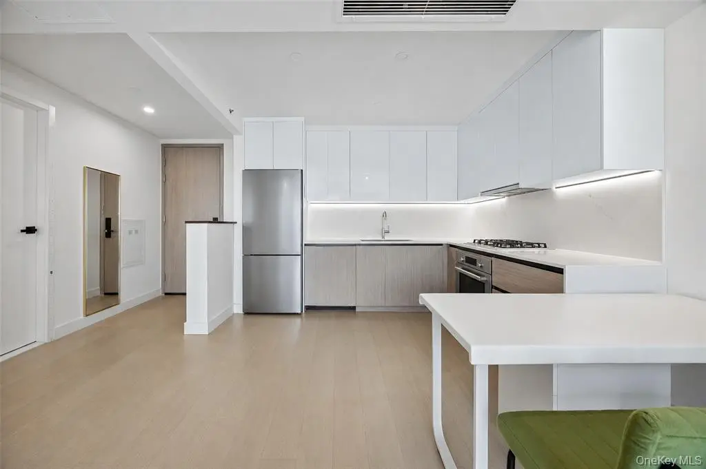 Wide view of the modern open-plan kitchen and living area