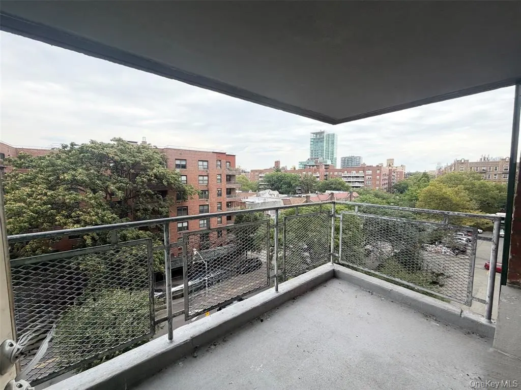 Large corner-unit balcony with neighborhood views