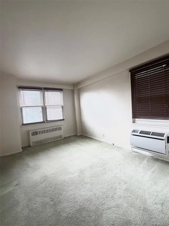 Bright bedroom with windows on two sides