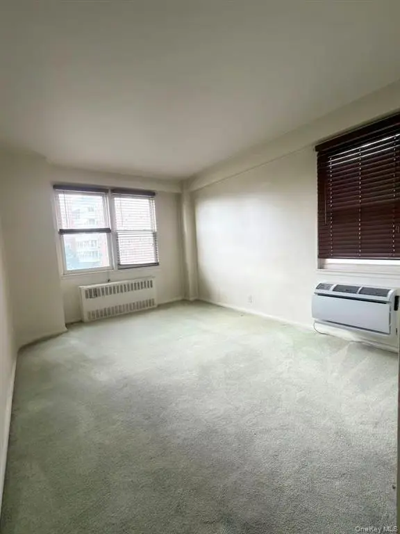 Bright bedroom with windows on two sides