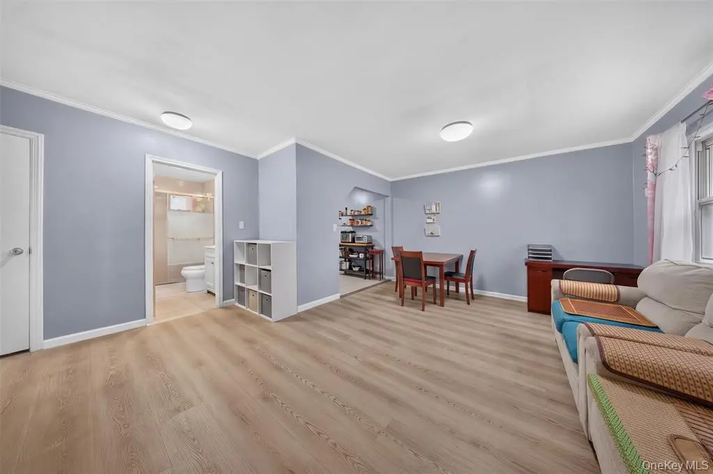 Open living area with light wood flooring