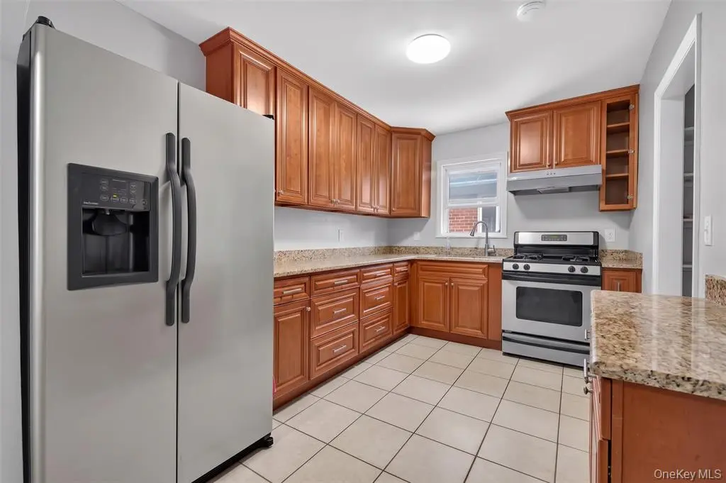 Kitchen with wood cabinets and stainless steel appliances