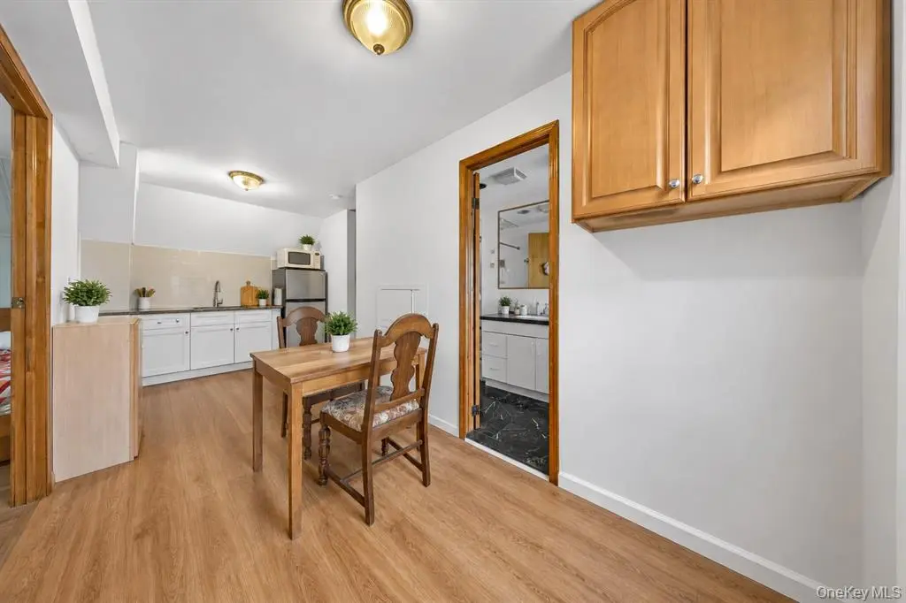 Kitchen and dining area with wood cabinetry