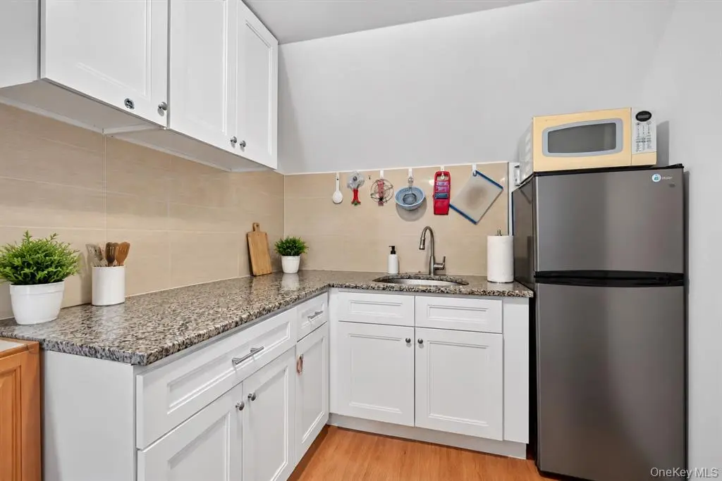 White kitchen with stone-look counters
