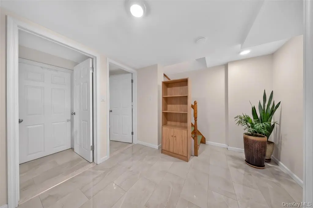 Finished interior hallway with multiple doors