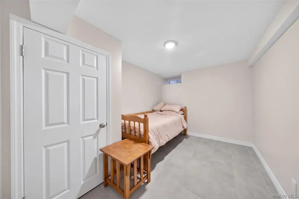 Private bedroom with light walls and flooring