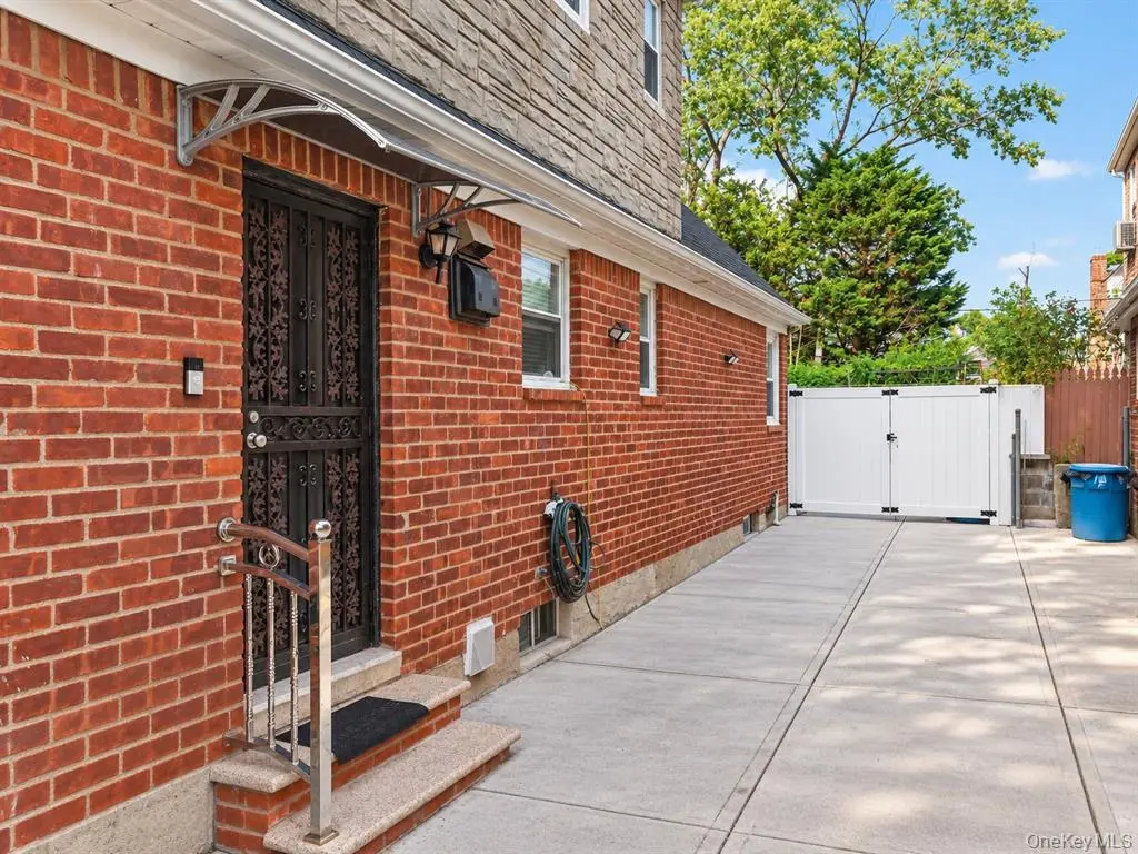 Brick side exterior and paved walkway
