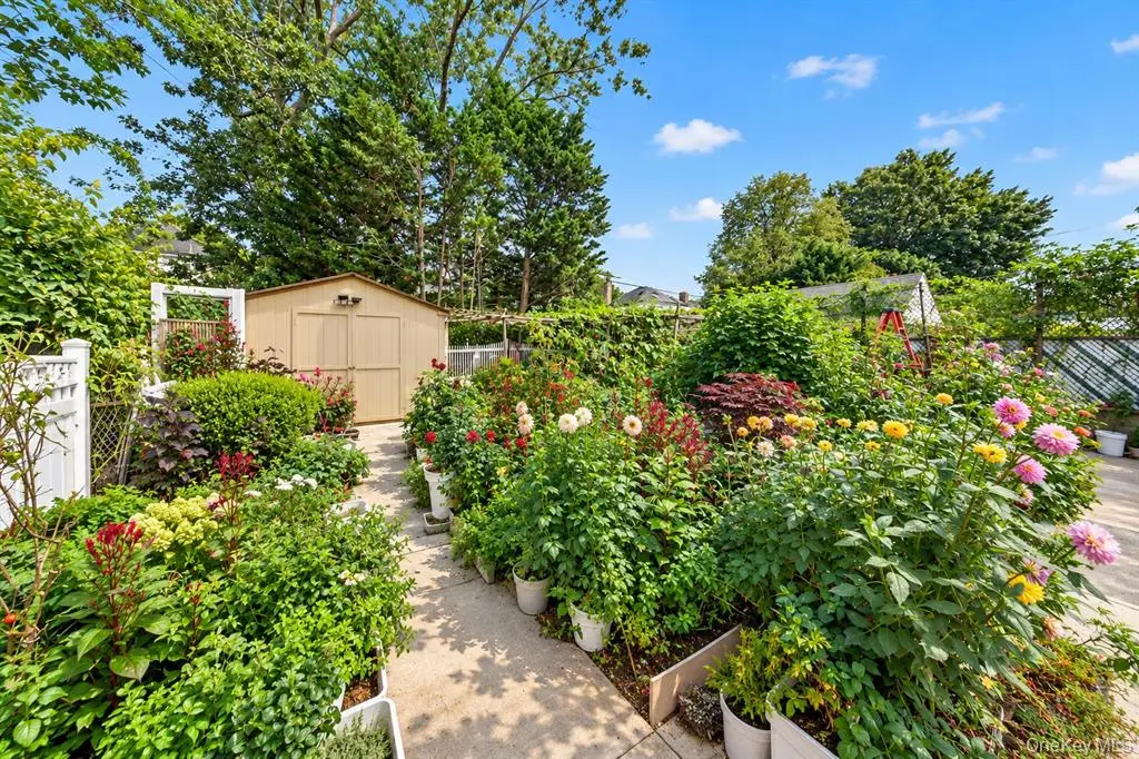 Landscaped backyard garden with mature plantings